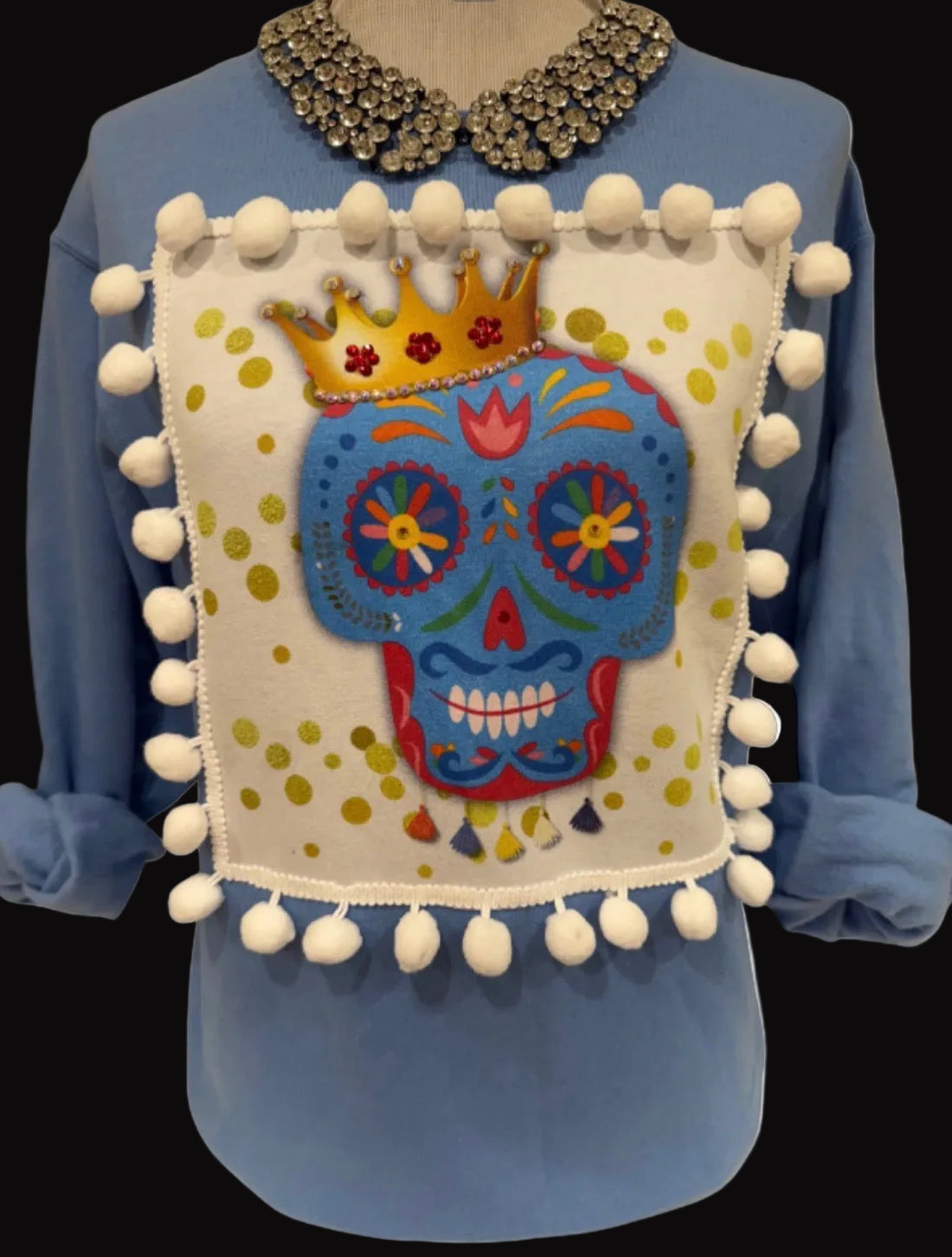 Extra Blingy Pom Pom Skull Patch on Carolina Blue Sweatshirt